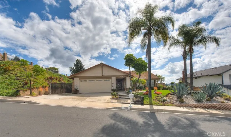 Wide and deep lot with gated RV parking.  RV parking can be made much larger with a retainer wall on the slope!