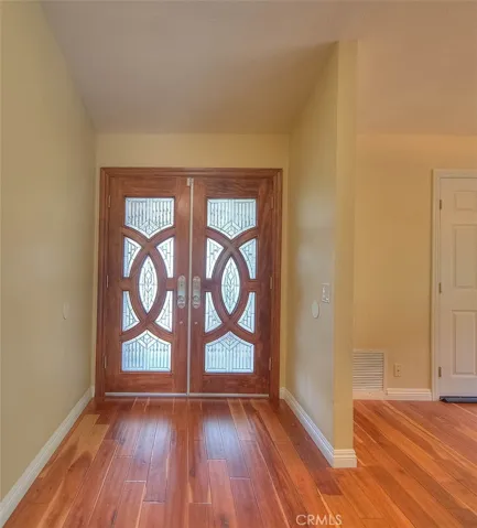 Foyer with wood flooring