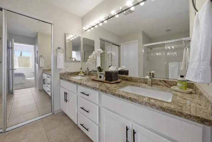 Modern bathroom with vanity and bedroom