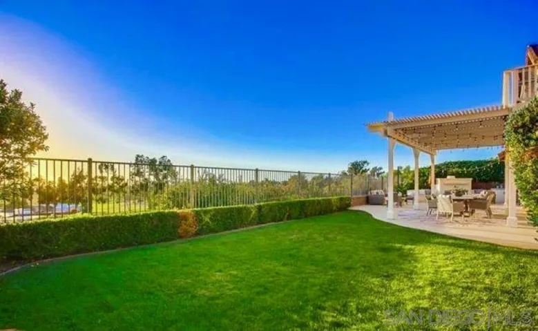 Fully fenced in backyard with spectacular views of the ocean and golf course