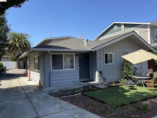 View of front of home featuring roof with shingles and board and batten siding