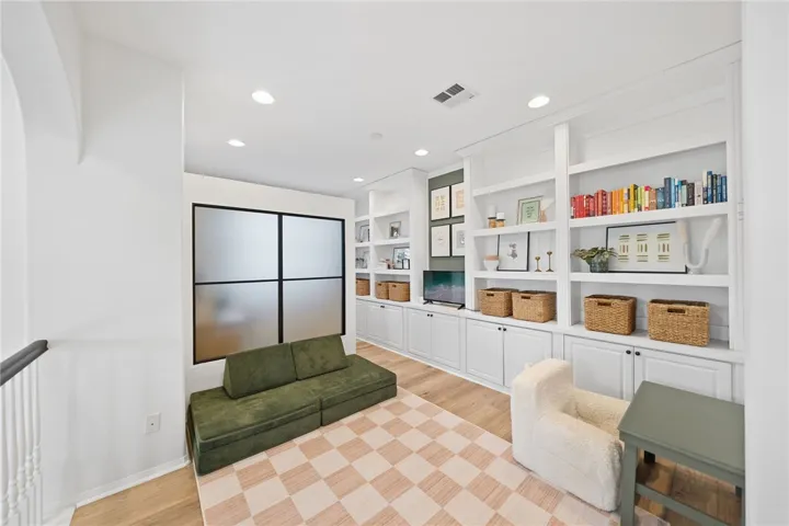 Loft space with built-in divider for home office privacy