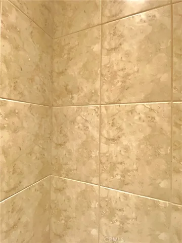The shower tiles match the floor tiles and are easy to clean, great quality and design.