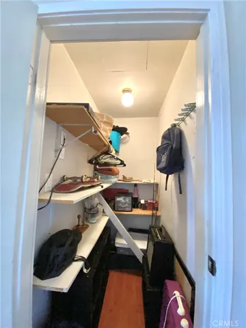 The walk-in closet is deep and spacious.