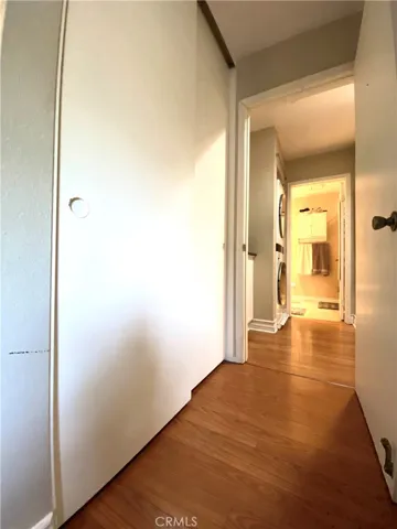 This is the view from the downstairs bedroom towards the bathroom. It has closet on the left side.