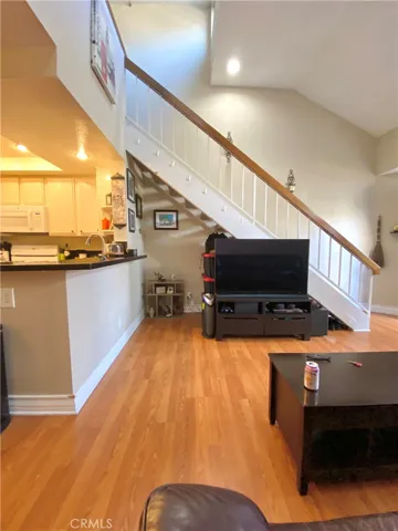 The TV is nestled under the stairs, out of the way and perfectly positioned.