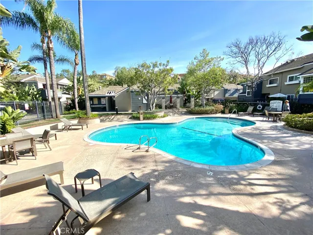 Take a dip in the tranquil pool located at the heart of the community, surrounded by a tropical garden. There are showers and bathrooms in the on-site building, as well as a large seating area with a long table and umbrella.
