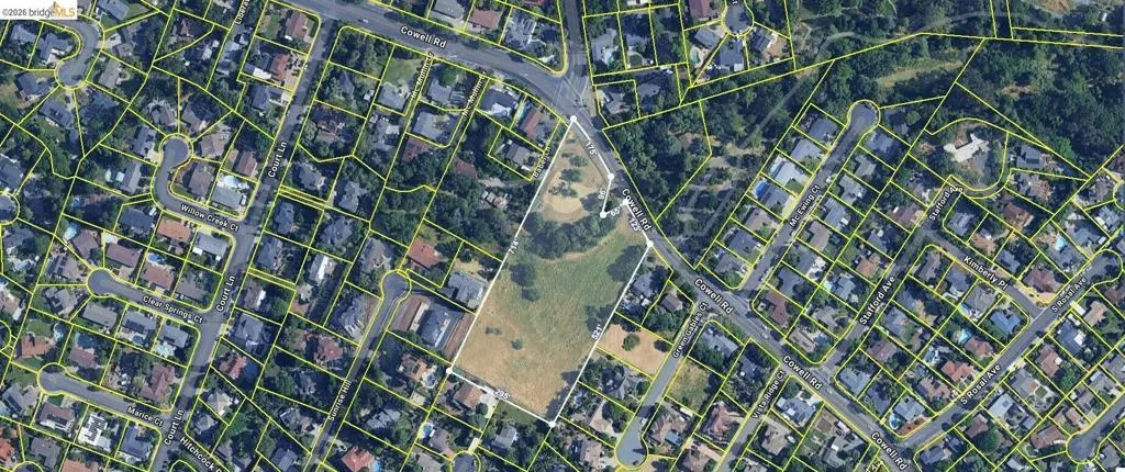 aerial map of property and surrounding area with property parcel outlined