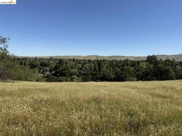 view of mountain backdrop featuring rural landscape
