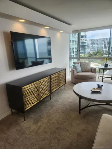 The large living room is so comfortable and a great place to gather. The large, shaded, no wind ocean and bay view balcony is accessed from the living room.