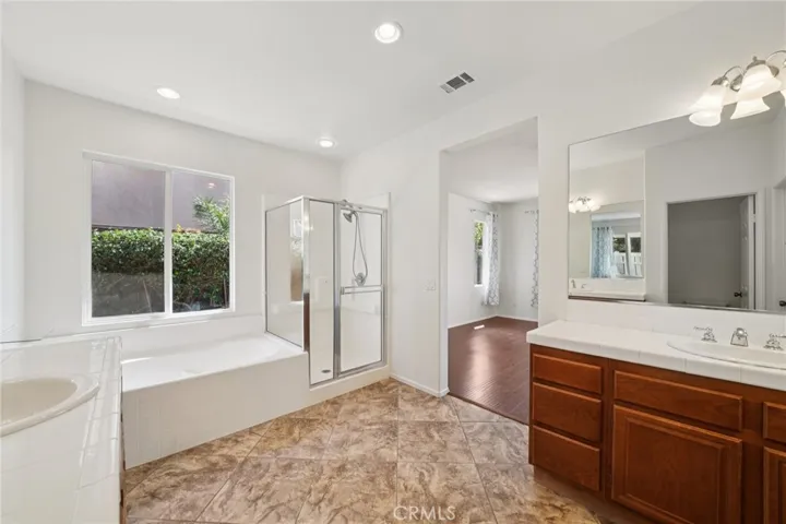 Spacious primary bathroom with natural light