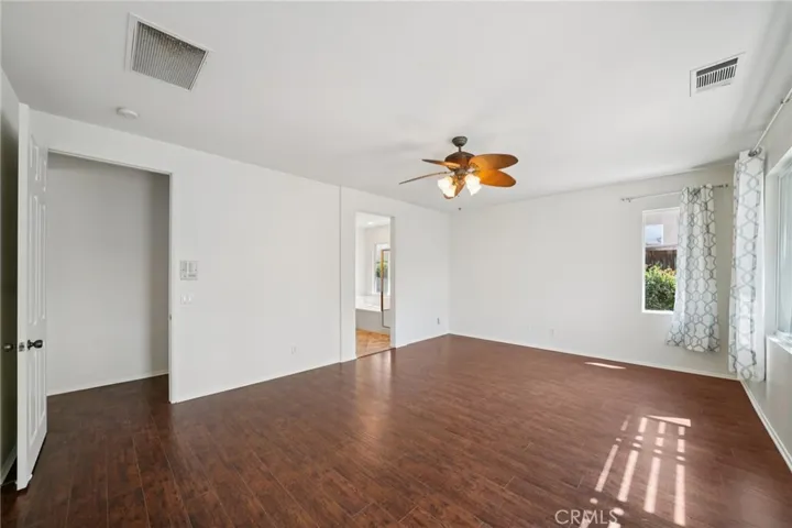 Spacious primary bedroom with private courtyard access