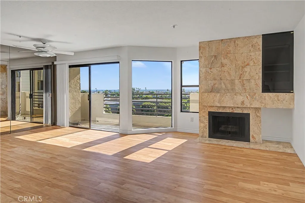 Ocean view living room with gas fireplace.