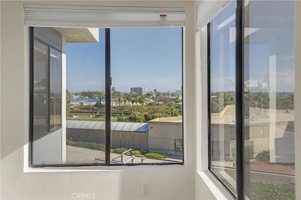 Double-door second bedroom looks to ocean and harbor and also make a great home office.