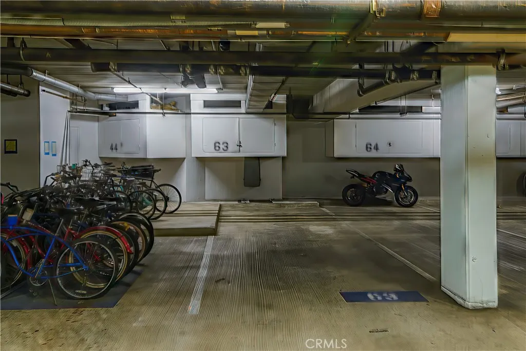 Unit 207's spaces are conveniently right by the elevator. Storage space above the tandem spaces.