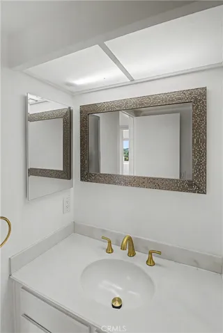 Bathroom has an additional 1/4 bath sink area to make sharing more convenient.