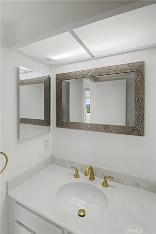 Bathroom has an additional 1/4 bath sink area to make sharing more convenient.