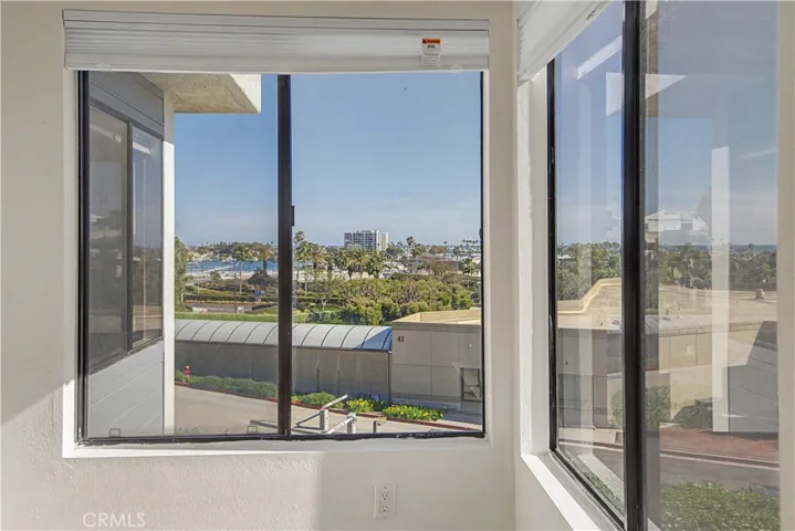 Double-door second bedroom looks to ocean and harbor and also make a great home office.