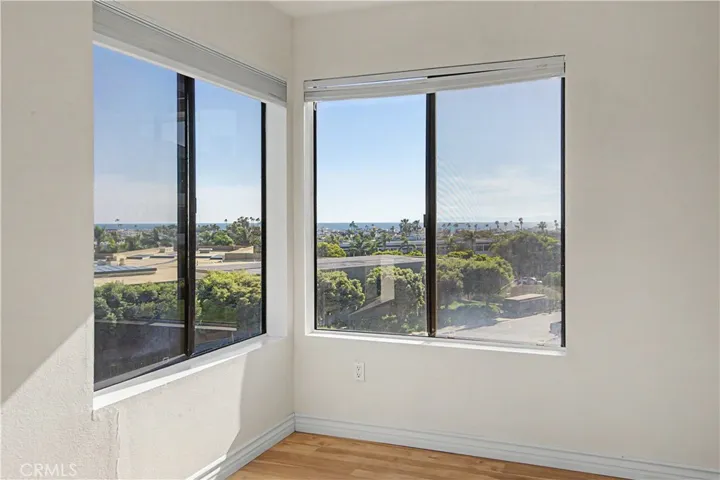 Primary bedroom on the corner looking out to the ocean and the harbor.