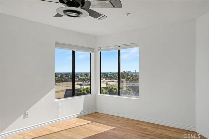 Primary bedroom on the corner looking out to the ocean and the harbor.