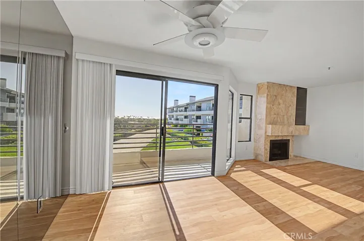 Ocean view living room with working fireplace.