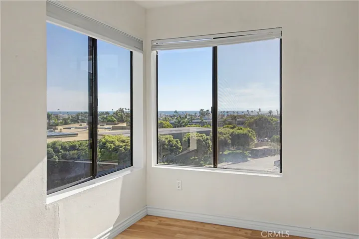Primary bedroom on the corner looking out to the ocean and the harbor.