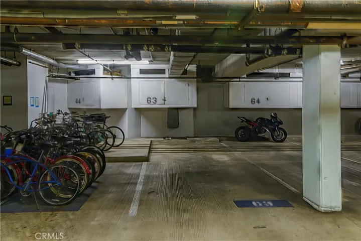 Unit 207's spaces are conveniently right by the elevator. Storage space above the tandem spaces.
