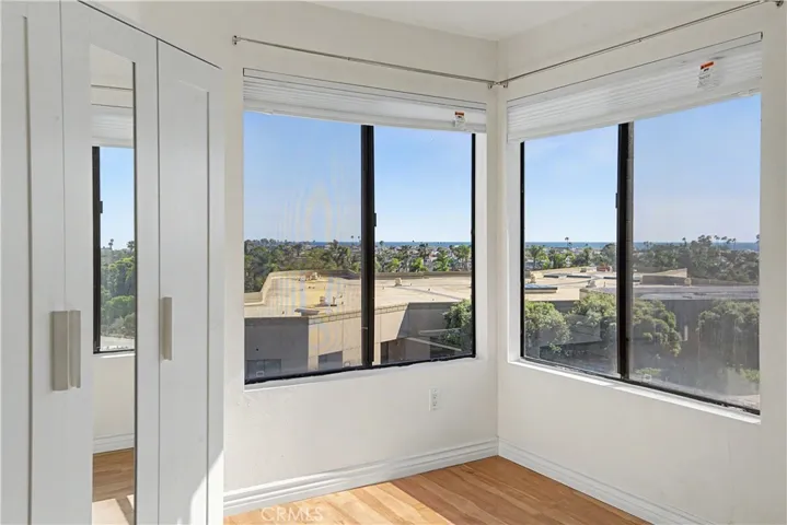 Double-door second bedroom looks to ocean and harbor and also make a great home office.