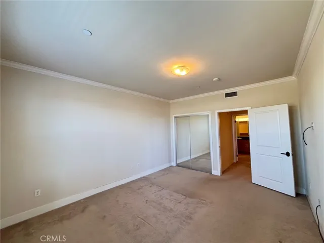 Main bedroom has a mirrored closet as well