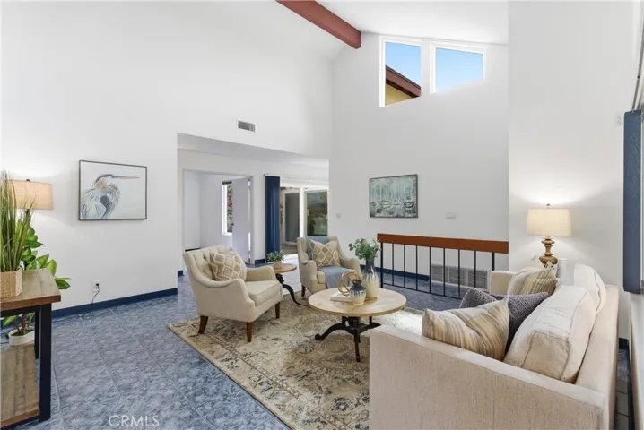Living room with vaulted ceilings and plenty of natural light