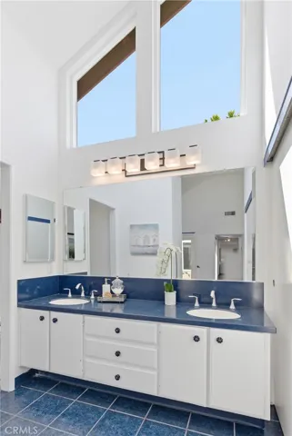 Primary bathroom with vaulted ceilings