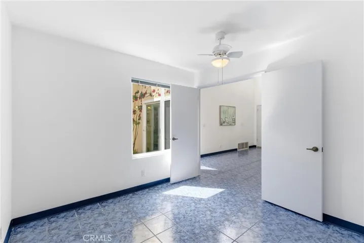 Bedroom 2 with atrium window view
