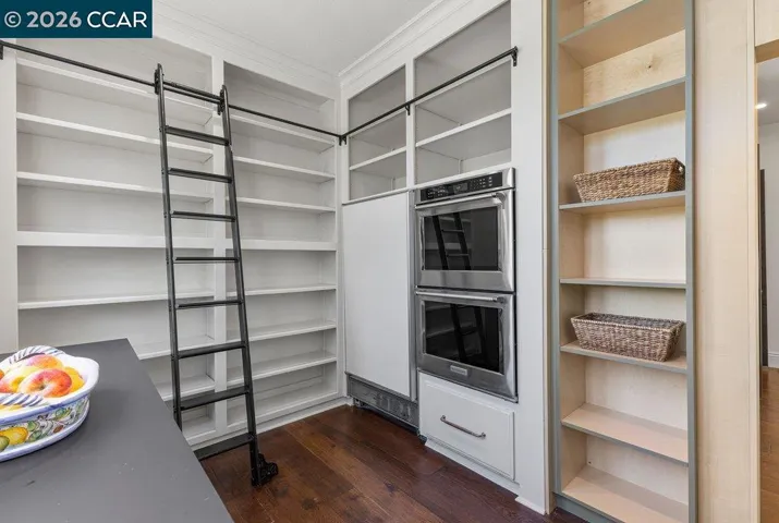 Hidden Pantry with refrigerator and 2 additional ovens