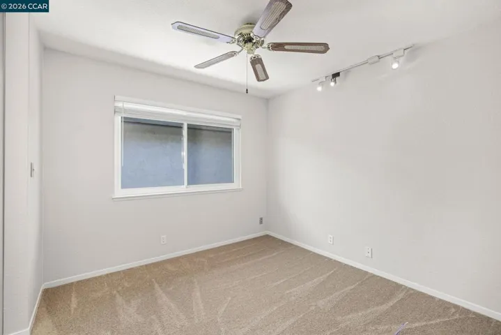 Guest bedroom overlooks side yard