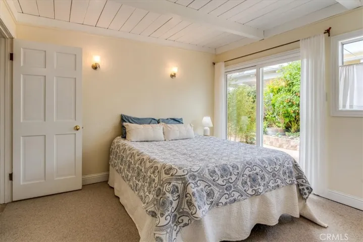 Bedroom #1 has a sliding door to the side patio