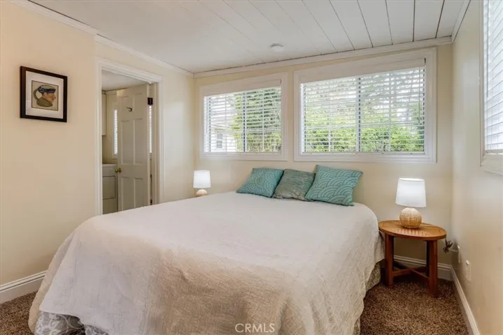 Bedroom #2. This bedroom has an en-suite half bathroom and combined laundry room.