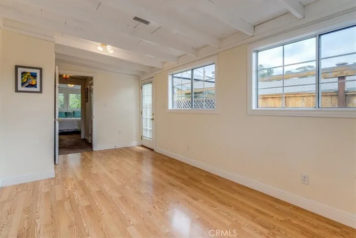 Bedroom #3, has a door to the side of the home.