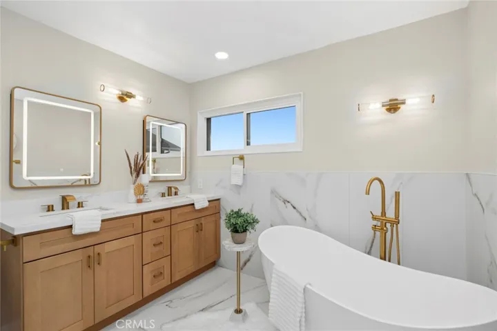 Deep freestanding designer soaking tub