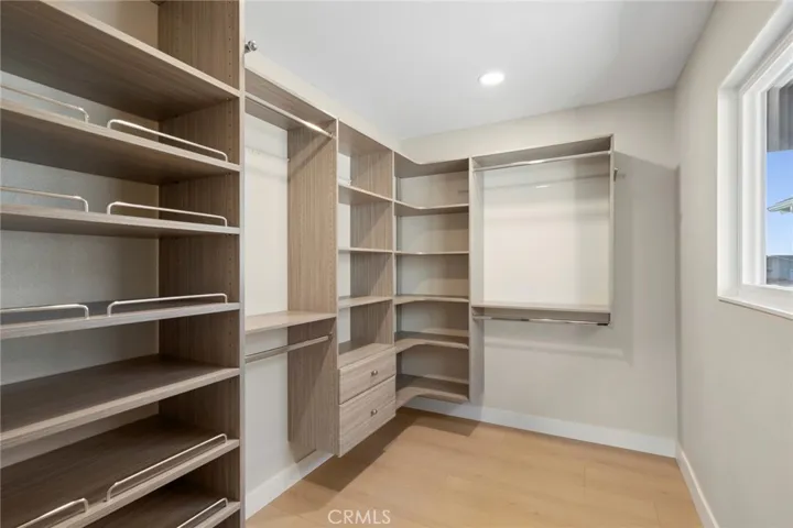 Dream Closet w/ multiple drawers/shelves & natural light through window