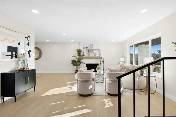 Updated, 100% waterproof 12mm laminate flooring flows seamlessly through the home