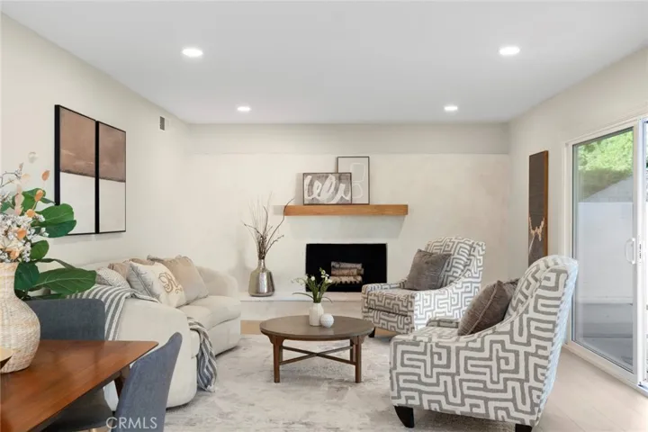 Refinished contemporary-style fireplace with striking 5-foot floating mantels (2)