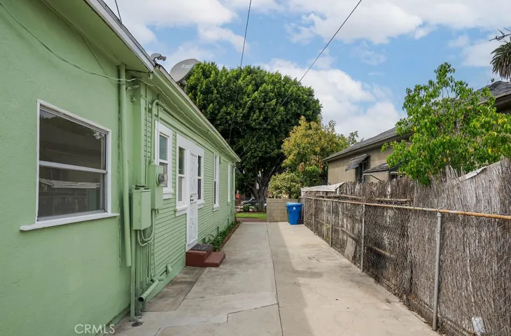 Side yard with the entrance to the JADU