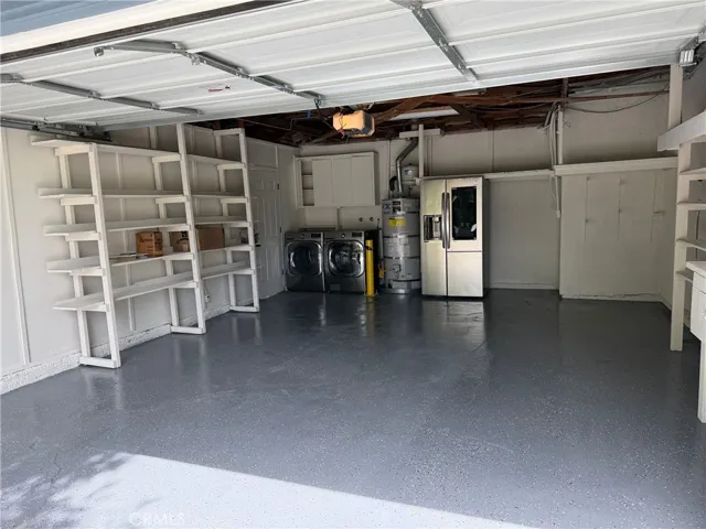 2 car garage w/epoxy floor, storage, washer & Dryer & 2nd refrigerator