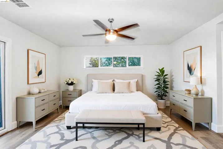 Bedroom featuring light wood-type flooring and ceiling fan