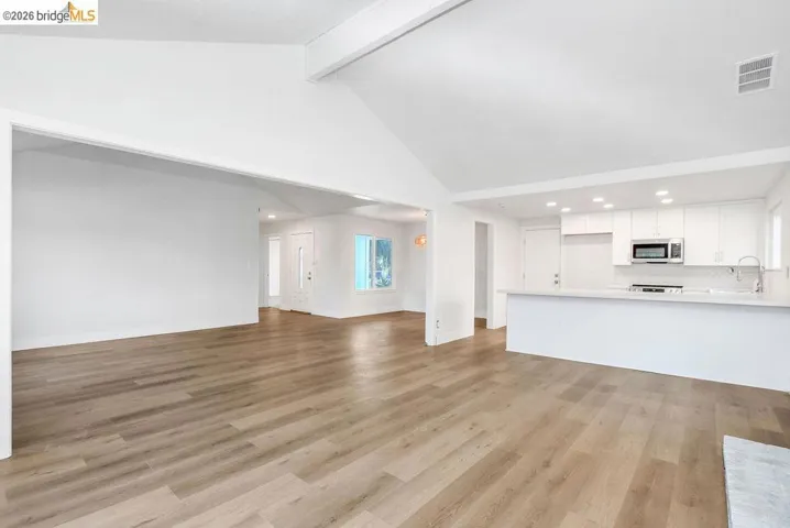 Unfurnished living room featuring recessed lighting and light wood finished floors