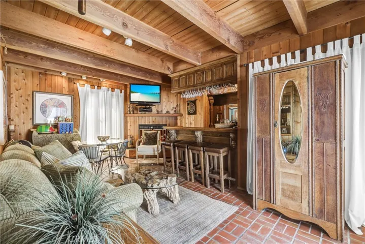 Den with Fireplace and Oak Bar