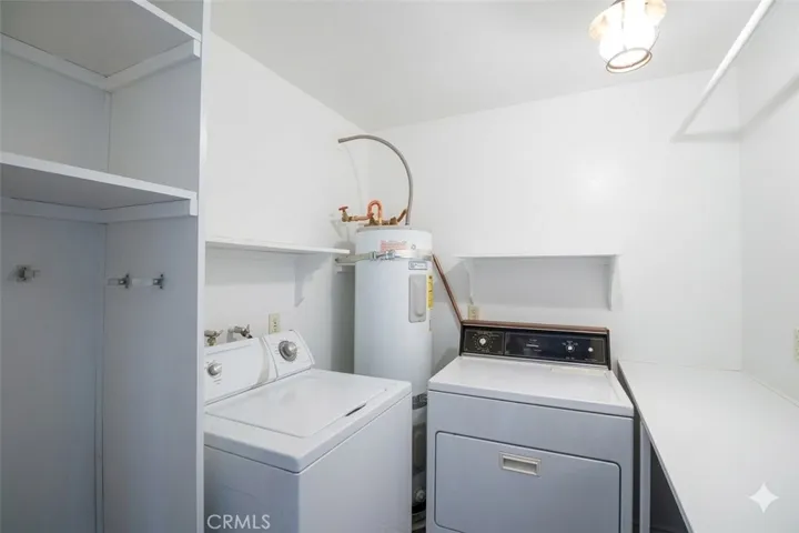 Laundry room with folding counter and shelving