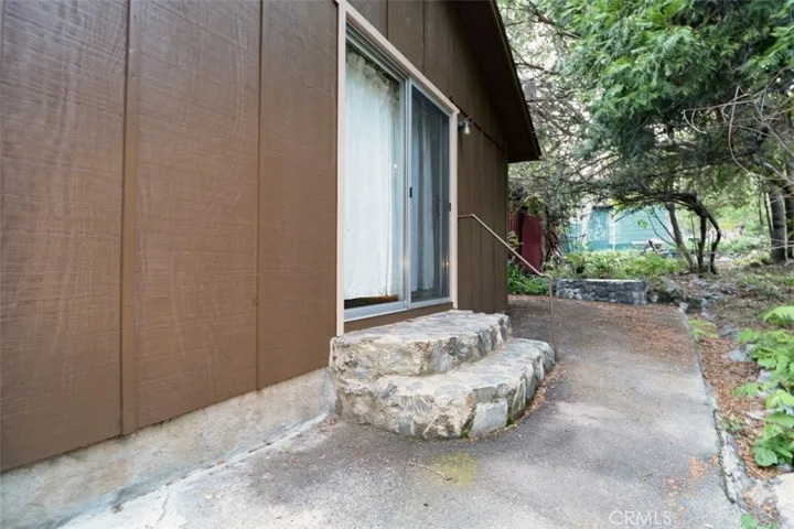 Rear porch-2 steps to flowing water