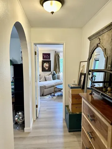 Hall leads 1 way to the Master Suite and the other, to 2nd BR & full Bath, and Laundry Room to Exit.