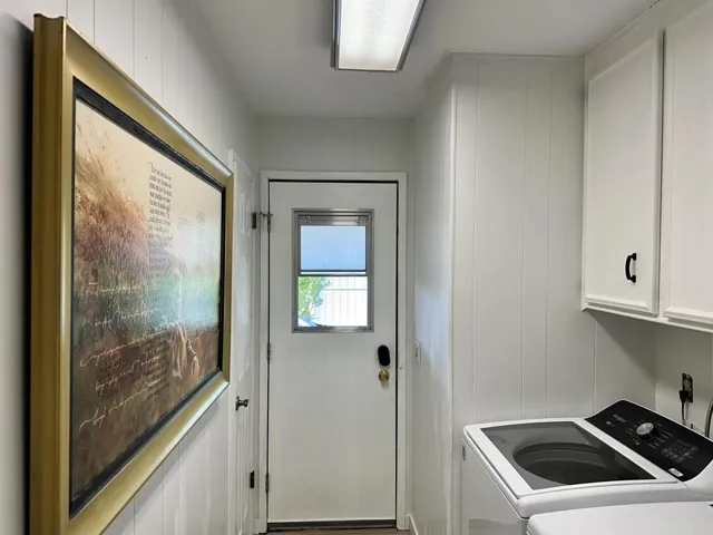 Also, 2nd Exit to Carport. Laundry area has 2 closets and upper cabinets above washer/dryer.